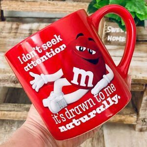 New m&m’s Funny Red I don’t seek attention it’s drawn to me naturally Coffee Mug